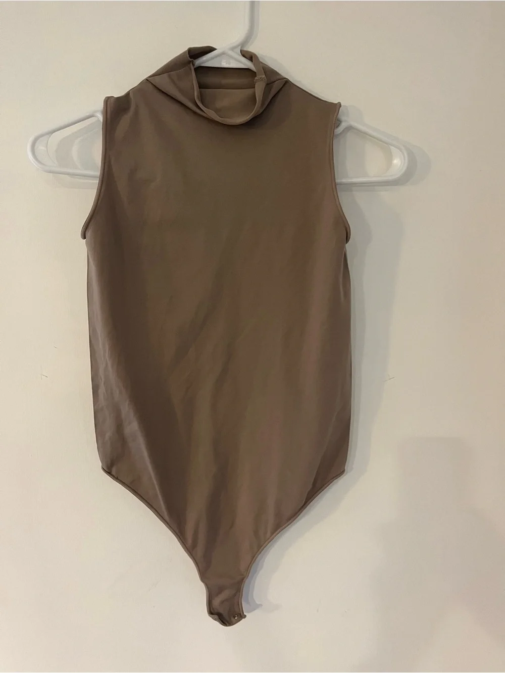 SKIMS Sleeveless High-Neck One-Piece Bodysuit in Taupe